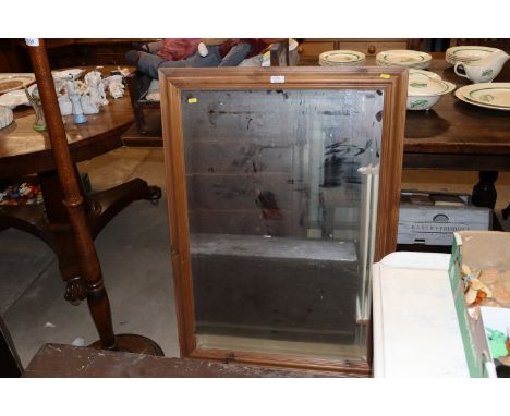 A large pine framed bevel edged wall mirror