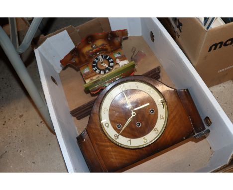 A three hole mantel clock and a cuckoo clock AF