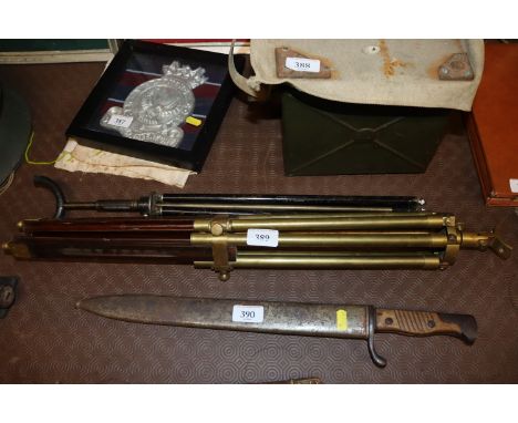 A vintage brass telescope tripod and one other 