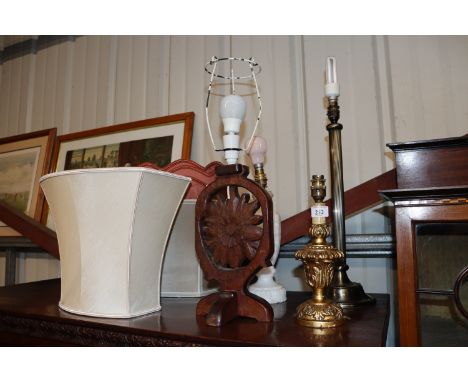 Four  various lamps and shade to include a carved wooden and alabaster lamp