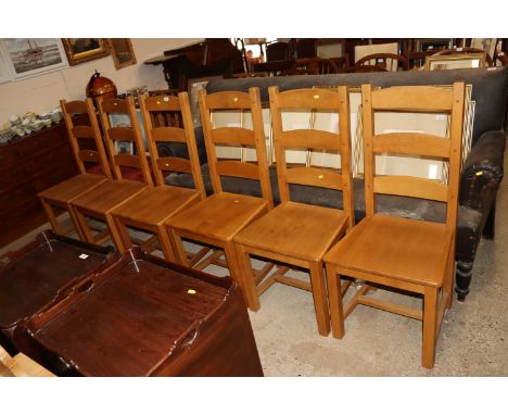 A set of six beech ladder back dining chairs 