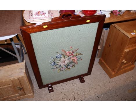 A mahogany and floral needlework firescreen 