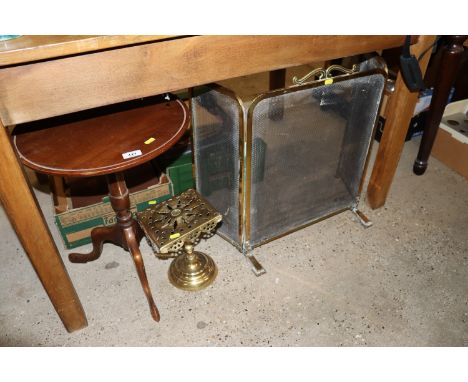 A brass stand; a brass three fold spark guard and a side table raised on tripod base