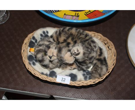 A Steiff kitten in basket