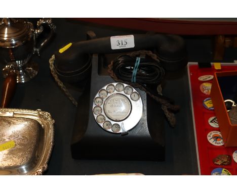 A vintage rotary dial telephone 