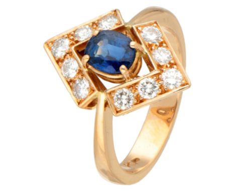 18k Yellow gold entourage ring set with synthetic sapphire and diamonds. Set with oval faceted synthetic sapphire (approx. 5.