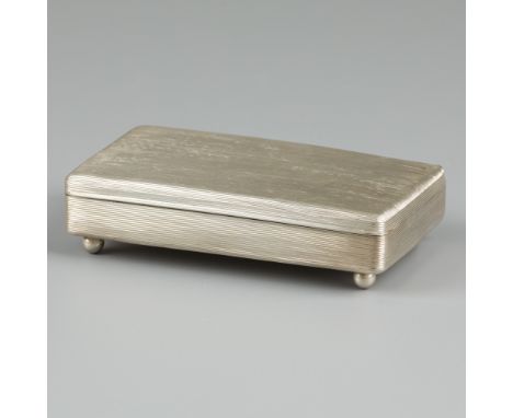 Teaspoon box / tobacco box silver. Former tobacco box converted into teaspoon box with 4 ball feet. Ribbed design lined with 