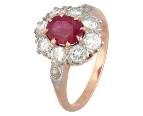 18K Rose gold entourage ring set with synthetic ruby and approx. 1.20 ct. diamond in platinum. Oval faceted synthetic ruby (7