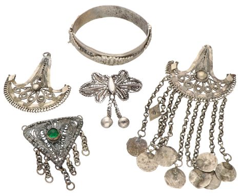 Lot filigrain pendants, brooch and a silver bangle bracelet. In good condition. Brooch tests as 74.3% silver and bangle is 82