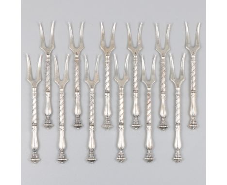 12-piece set of cocktail forks silver. With moulded decorations. Netherlands, Schoonhoven, J. Niekerk, second half 20th centu