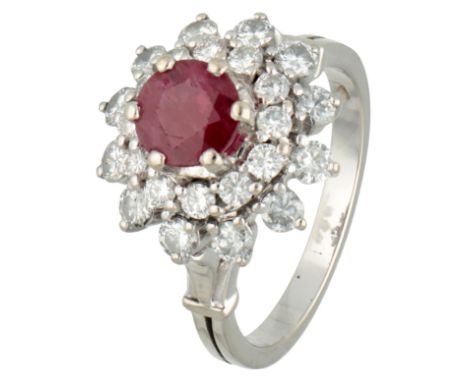 18K White gold entourage ring set with approx. natural ruby and diamonds. Set with a round faceted natural ruby of approx. 0.