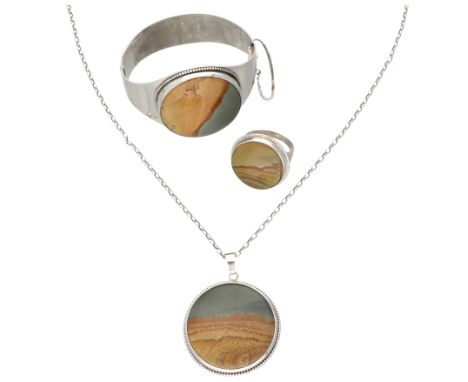 Set of three pieces of silver jewellery each set with a landscape jasper. In good condition. Hallmarks: 835 Dutch assay mark,