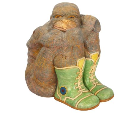 A late 20th century slipcast ceramic ape in green boots, gallery label to base "BC 18", unsigned, height 22cmSurface dirt /st