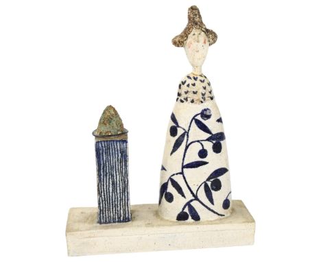 Jane Muir studio ceramic sculpture, woman with plate on plinth, signed under base, height 34cm, length 26.5cmFigures has been