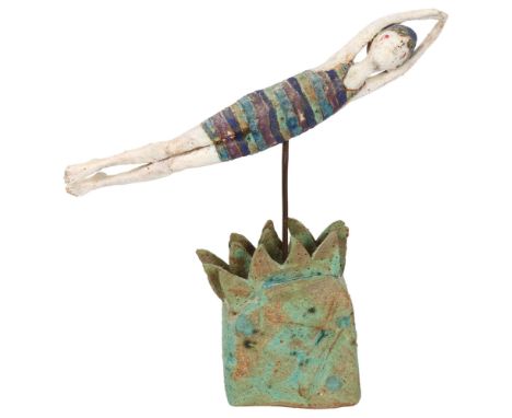 Jane Muir, studio ceramic sculpture of a swimmer in waves, pen signed to base, height 29cm, length 33cmGood condition, no chi