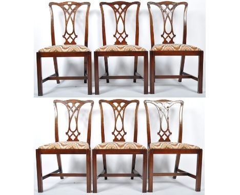 A set of six Chippendale Revival mahogany dining chairs having a hand carved scrolled and decorative pierced vase splat knot 