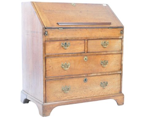 A large antique late 18th / early 19th Century Georgian George III light oak bureau desk of typical form having a fall front 