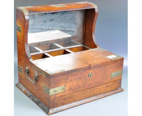 An antique 19th Century Victorian oak decanter box tea caddy compendium in the manner of Betjeman having a mirror back three 
