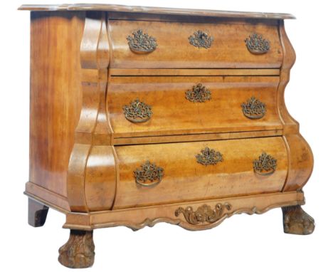 An antique late 19th Century walnut commode chest of drawers of serpentine bombe form. The graduating bank of three drawers h