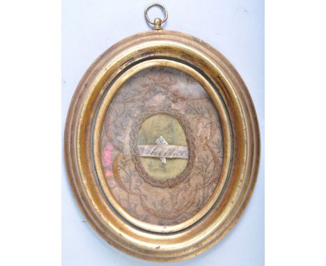 An antique 19th Century Religious Ecclesiastical Reliquary relic&nbsp; for St Michael having a central name piece in embroide