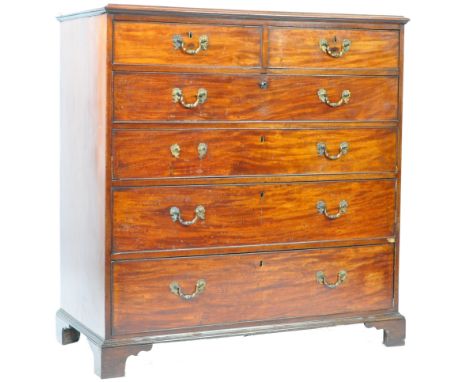 A large antique late 18th / early 19th Century Georgian George III English mahogany chest of drawers. The chest having a flar