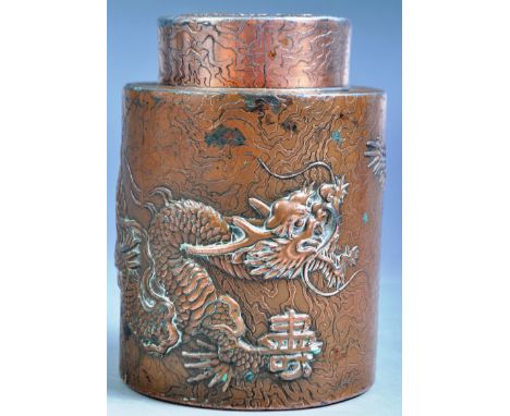 An antique 19th Century Chinese Oriental heavy copper on white metal tea caddy of simple cylindrical having a cover atop with