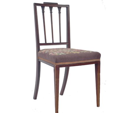 An antique 19th Century Georgian mahogany and tapestry dining / side hall chair having a decorative carved backrest with flor