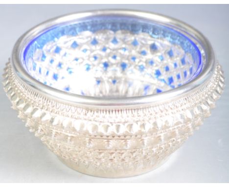 An antique 19th Century Indian Raj Period silver sugar bowl / trinket bon bon dish having intricate repousse geometric decora