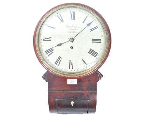 An antique 19th Century English flame mahogany drop dial wall hanging station factory marked to face for&nbsp;George Muston, 