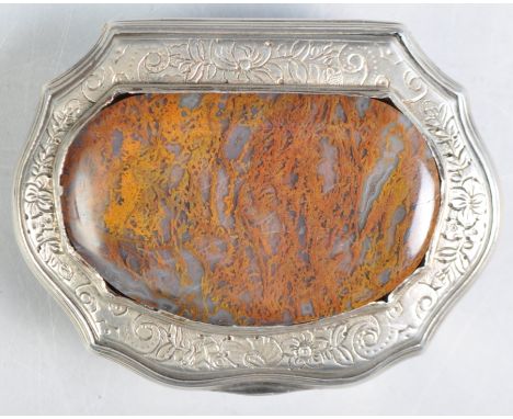 An 18th Century silver and gilt Memento Mori snuff box having a large inset agate stone to the lid with engraved floral detai