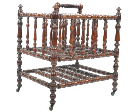 An impressive antique 19th Century Victorian walnut bobbin turned magazine rack canterbury having turned finial column tops w