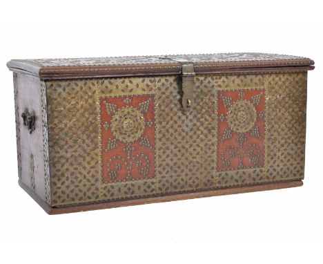 An antique early 19th Zanzibar oak trunk coffer chest having intricate brass studded geometric triangular / tree of life deco