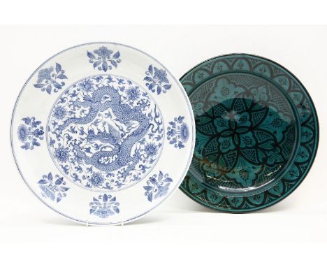 A modern Chinese blue and white charger, decorated with a five toed dragon, together with decorative ceramic, wood and glass 