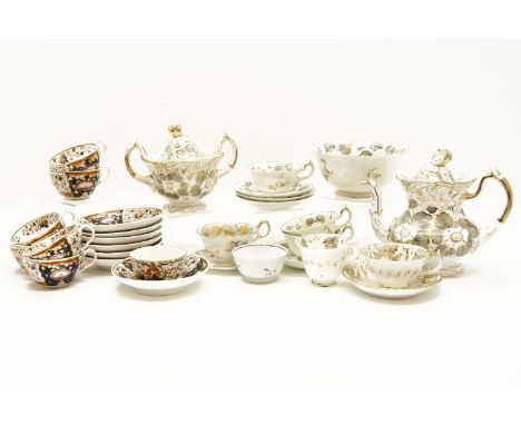 A Rockingham type part tea service, consisting of teapot, sucrier, slop bowl, various cups and saucers, together with a Derby