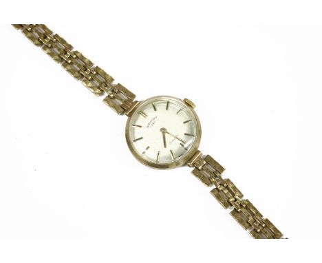 A ladies gold Rotary mechanical bracelet watch, with three row diamond cut gate bracelet, silvered dial and baton markers15.7