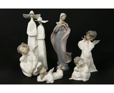 Six Lladro figures, including nuns, the Virgin Mary and four angels, all boxed