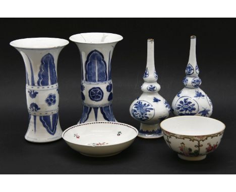 A pair of Chinese blue and white porcelain triple gourd vases, 18th/19th Century,decorated with panels of flowers, surrounded