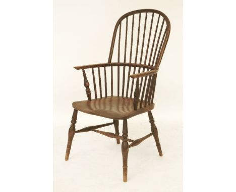 An early 19th century hoop and stick back Windsor armchair, stamped 'TA' to back of seat