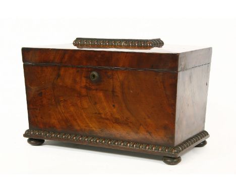 A Victorian mahogany sarcophagus tea caddy, with lidded boxes, either side of a well, lacking bowl, 35cm wide