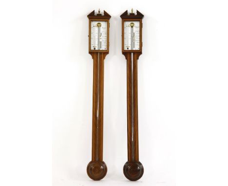 A pair of Georgian style stick barometers, silvered dial, broken pediment to top