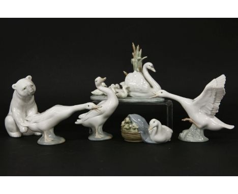 Six Lladro figures, including four models of ducks, a swan and cygnets, and a polar bear, all boxed