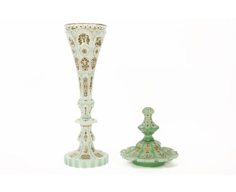 A Bohemian green glass vase, with gilt and enamel decoration, and an associated lid, vase 41cm, lid 17cm high (wear to gildin