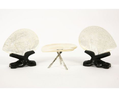 Two Chinese mother of pearl carved shells on wooden stands, and another with white metal mount, and 'bamboo' tripod, 9cm high