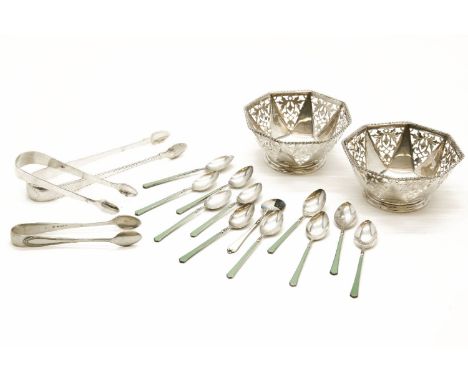 A pair of octagonal silver bowls, Sheffield 1935, with pierced decoration, 10cm diameter, two pairs of silver sugar tongs, Du