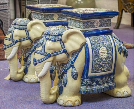 ELEPHANT GARDEN SEATS, a pair, vintage blue and white ceramic elephants with seats, 43cm H x 23cm x 50cm L. (2)