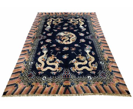 CANTONESE DRAGON CARPET, part silk, 278cm x 174cm, of sapphire field and polychrome borders.