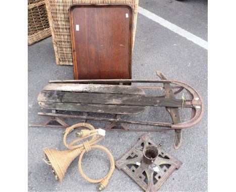 AN EARLY 20TH CENTURY CAST IRON CHRISTMAS TREE STAND 30cm square, a steerable sledge, a wooden tray, and a ropework light pen