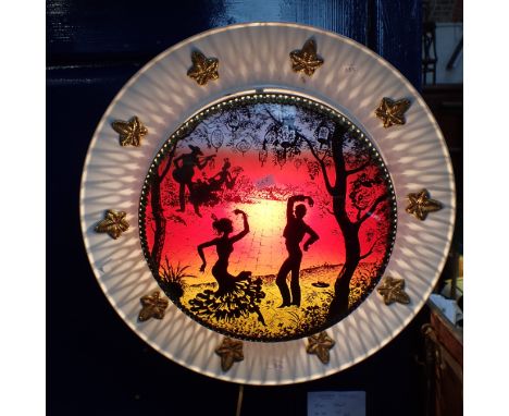 A KITSCH 1950s WALL LIGHT with glass panel painted with flamenco dancers, in a metal frame