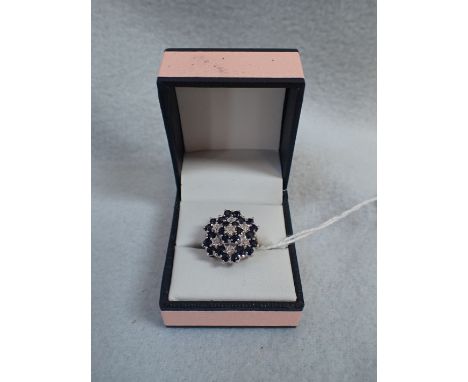 A GOLD DRESS RING FLOWER-SET WITH DIAMONDS 