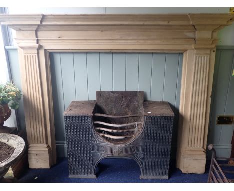 A GEORGE II STYLE STRIPPED PINE FIRE SURROUND the shelf 182 cm wide, opening 104cm high, 111cm wide (some mouldings loose)